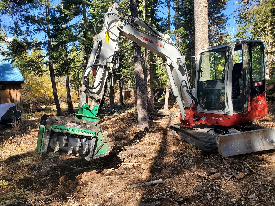 image of stump grinding brush chipping tractor machine clearing forest in North Lake Tahoe City Truckee
